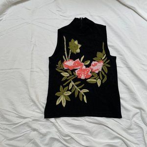 Cabo Sleeveless Black Sweater with Rose Applique.